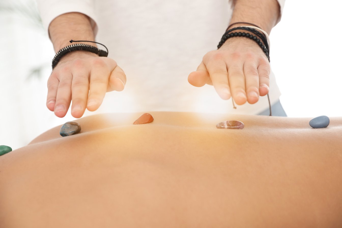 Man during Crystal Healing Session in  Room, Closeup